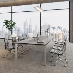 arcline meeting table in dark wood with silver matte leg finish in a room with large windows.